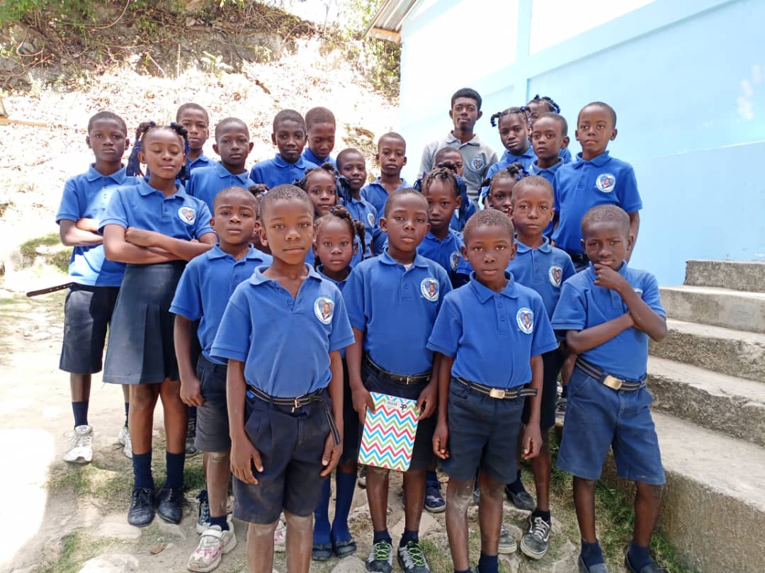 Students in blue uniforms at the Centre d'Études Jeff Cherubin Domond