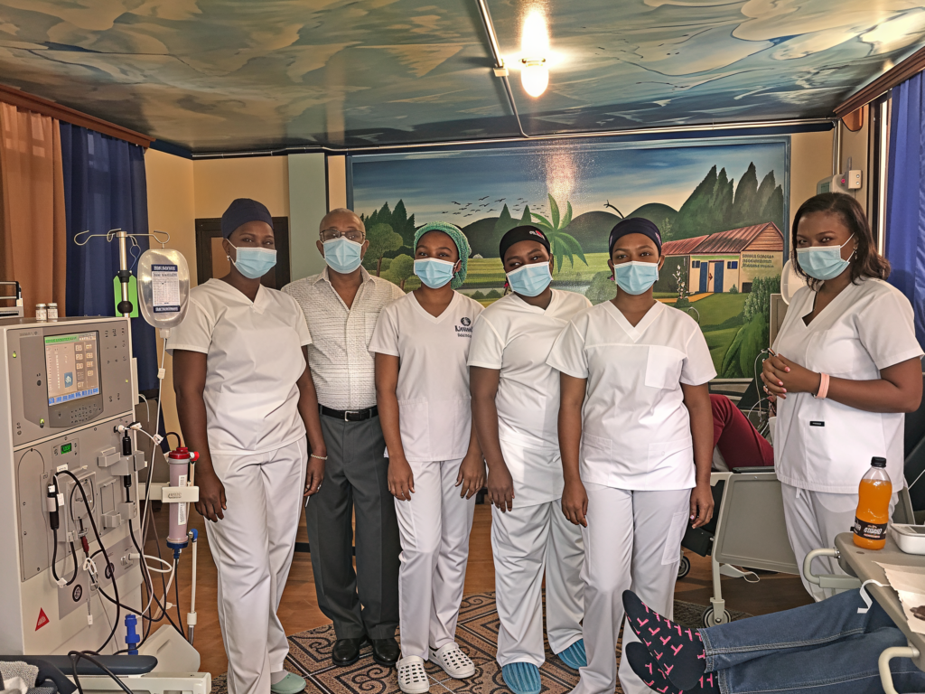 Nurses and staff of the Centre de Dialyse Jeff C. Domond beside a dialysis machine